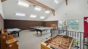 Game room featuring beamed ceiling, carpet flooring, billiards table, and high vaulted ceiling