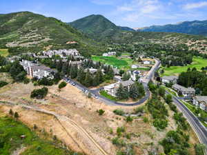 Aerial perspective of suburban area with a mountainous background