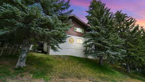 Yard at dusk with a lawn