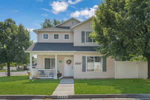 View of front of house featuring a porch and a shingled roof