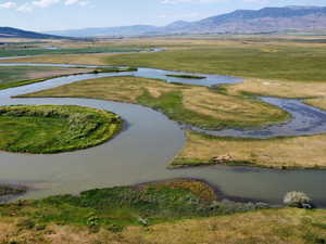 View of property location with a water and mountain view