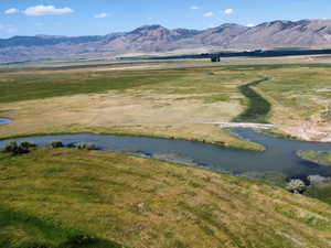Mountain view with a large body of water and rural landscape