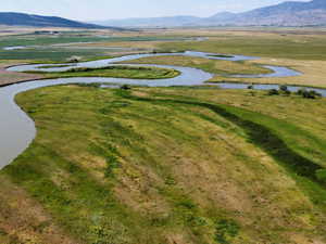 View of property location with a water and mountain view