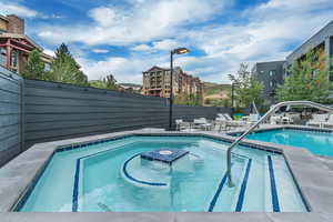 Community pool featuring a patio