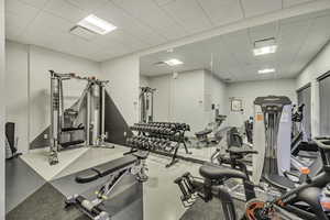 Gym featuring a paneled ceiling