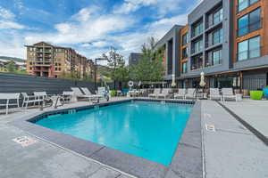 Community pool with a patio area