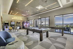 Playroom with carpet, a mountain view, and pool table