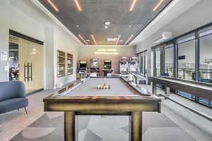 Game room featuring carpet and pool table