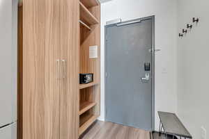 Mudroom featuring light wood-type flooring