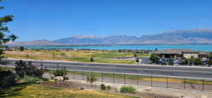 View of mountain backdrop featuring a nearby body of water