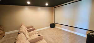 Home theater room featuring carpet floors and recessed lighting