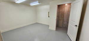 Below grade area featuring baseboards