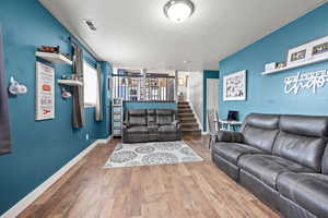 Living room featuring wood-type flooring