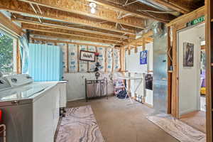 Basement featuring washer and clothes dryer