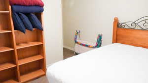 Carpeted bedroom with baseboards
