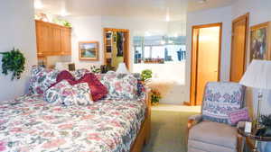 Tiled bedroom with carpet