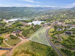 View of property location with a water and mountain view and property boundaries highlighted