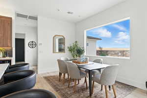 Dining room with light wood-style flooring