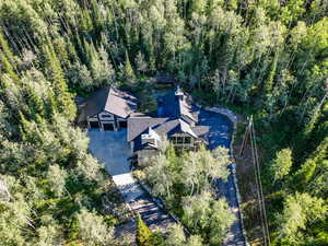 View of subject property featuring a heavily wooded area