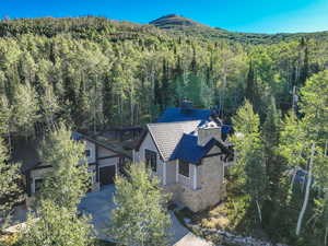 View of subject property with a forest