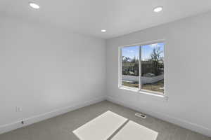 Unfurnished room featuring carpet floors and recessed lighting