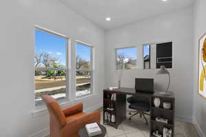 Office space featuring recessed lighting and tile patterned flooring