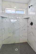 Full bath with tiled shower