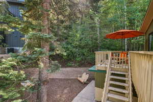 View of yard featuring a deck and stairway