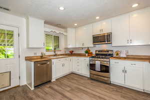 Gleaming Stainless Steel Appliances and New Quality LVP Flooring!