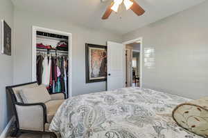 Bedroom with a closet and a ceiling fan