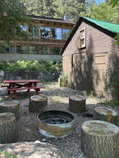 View of yard with an outdoor fire pit