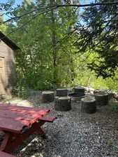 View of yard with an outdoor fire pit
