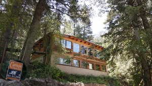 View of property exterior with a chimney