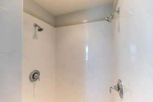 Cultured marble oversized master walk in shower in the master bath