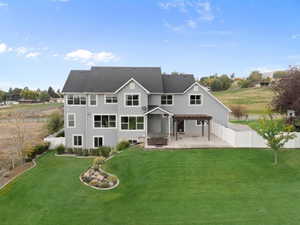 Back of property with a patio area and a fenced backyard