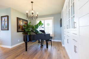 Formal Living converted to a perfect area for a Grand Piano Area & added china cabinets.