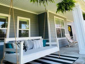 372 SF Front Porch, Custom Swing (storage below)
