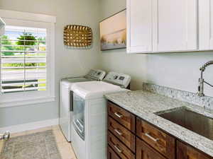 Main Floor Laundry with Granite Countertops, added cabinets & Sink