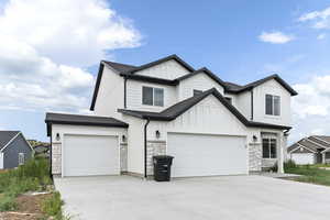 Modern farmhouse exterior. *Photos show 3rd car garage, which adds an additional cost