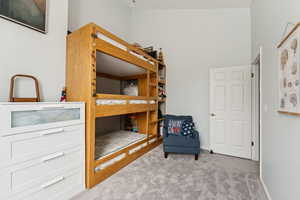 Carpeted bedroom with baseboards