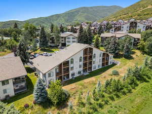 Aerial view of residential area featuring a mountain backdrop
