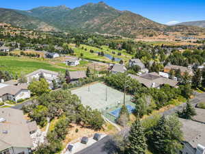 Aerial perspective of suburban area with a water and mountain view