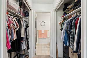 Spacious closet with tile patterned floors