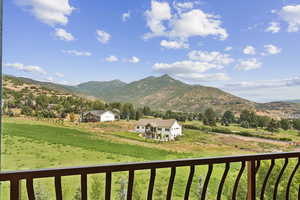 View of mountain backdrop featuring rural landscape