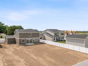 Rear of home. Partially fenced.