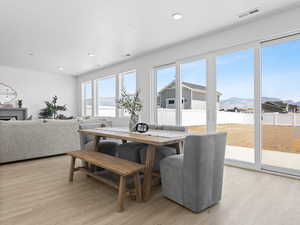 Dining space with large multi-panel sliding door.