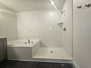 Bathroom with a garden tub and a shower