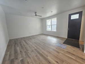 Foyer featuring wood finished floors and a ceiling fan
