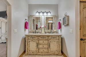 Bathroom with double vanity and a shower