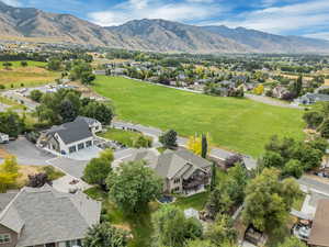 Aerial perspective of suburban area featuring a mountainous background